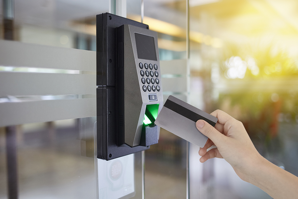 Young woman hold key card to access door office PA system